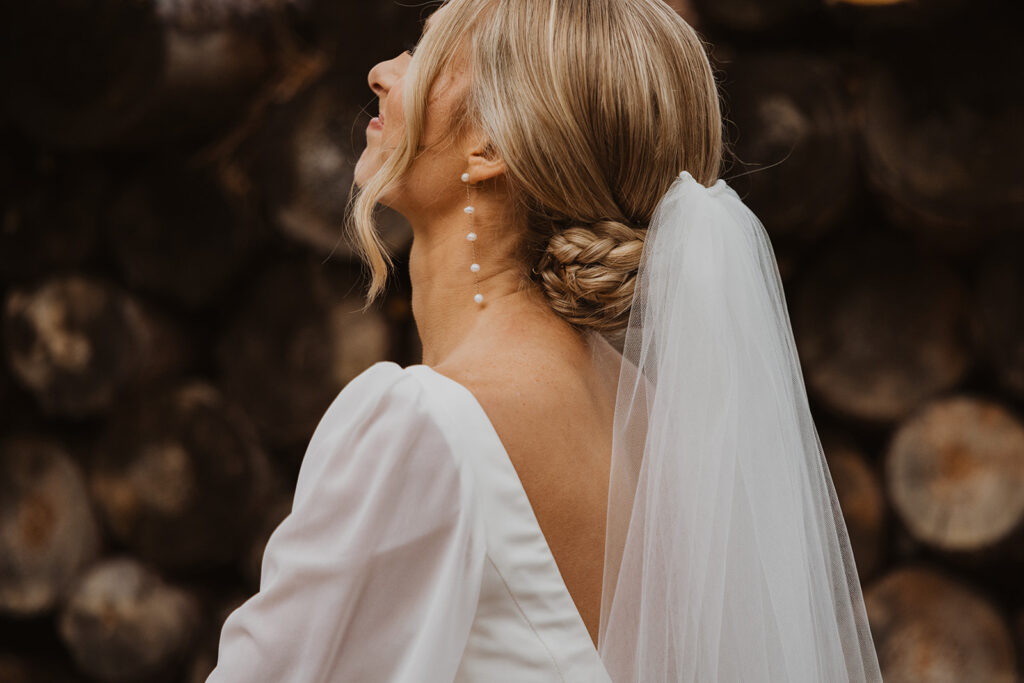 Bride looks up at the sky with glee at getting married