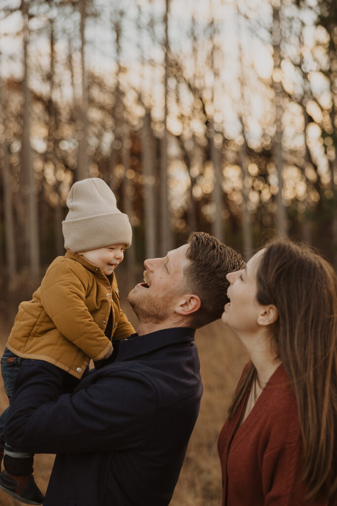 Parents play with their young son