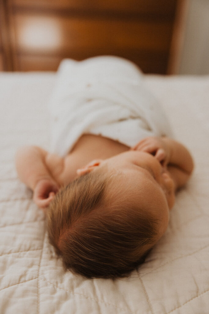 Soft, downy hair on newborn baby