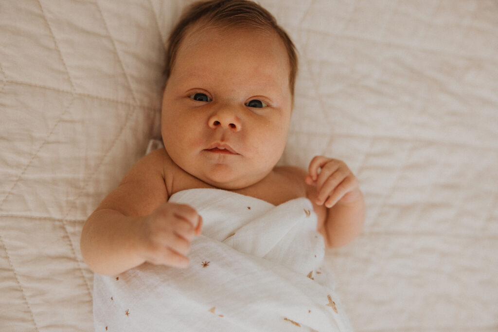 Newborn baby wakes gently